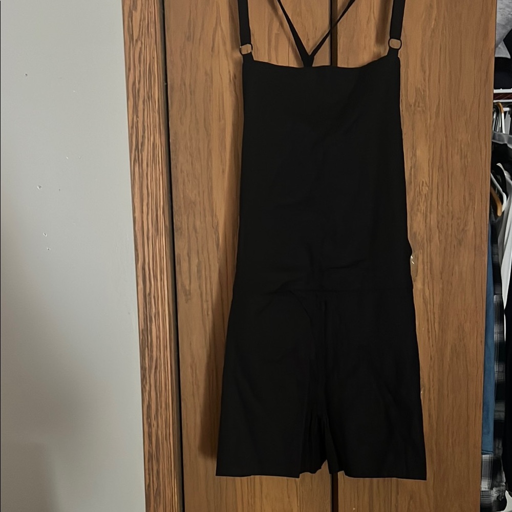 Black Strappy overall shorts.
